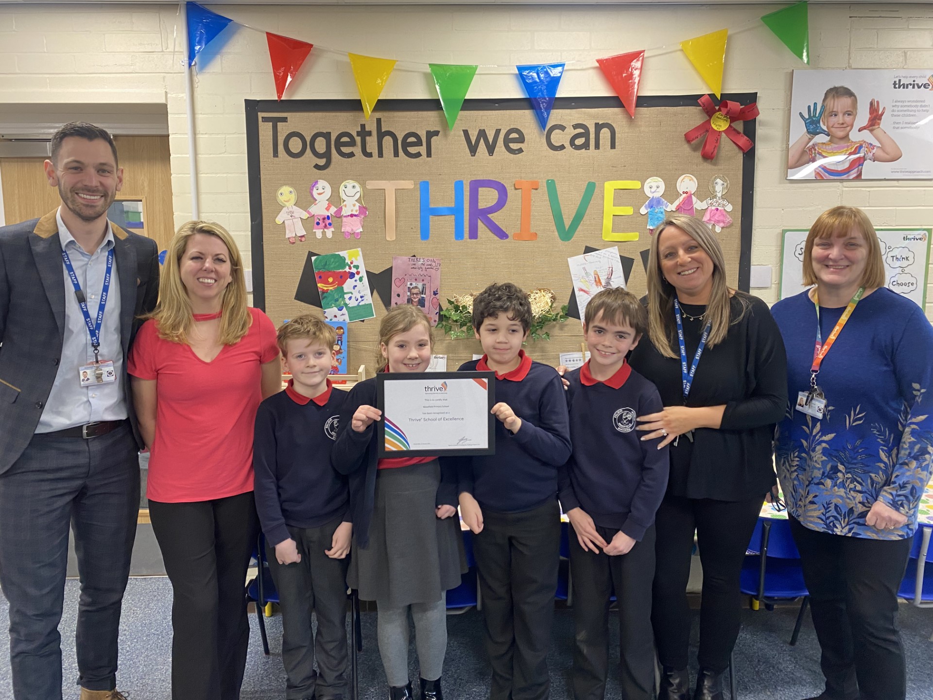 Pupils and staff at Masefield Primary School with their Thrive School of Excellence award